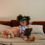 Modern kids room with soft and safe styling featuring neutral walls, cozy bedding, rounded furniture, plush rugs, and child-friendly decor for comfort and simplicity