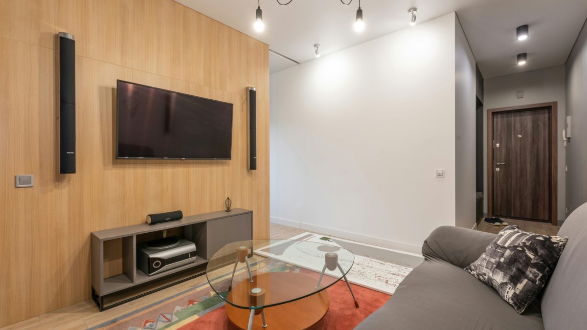 Space-smart sofa bed in modern living room maximizing small space Extendable dining table in compact contemporary home