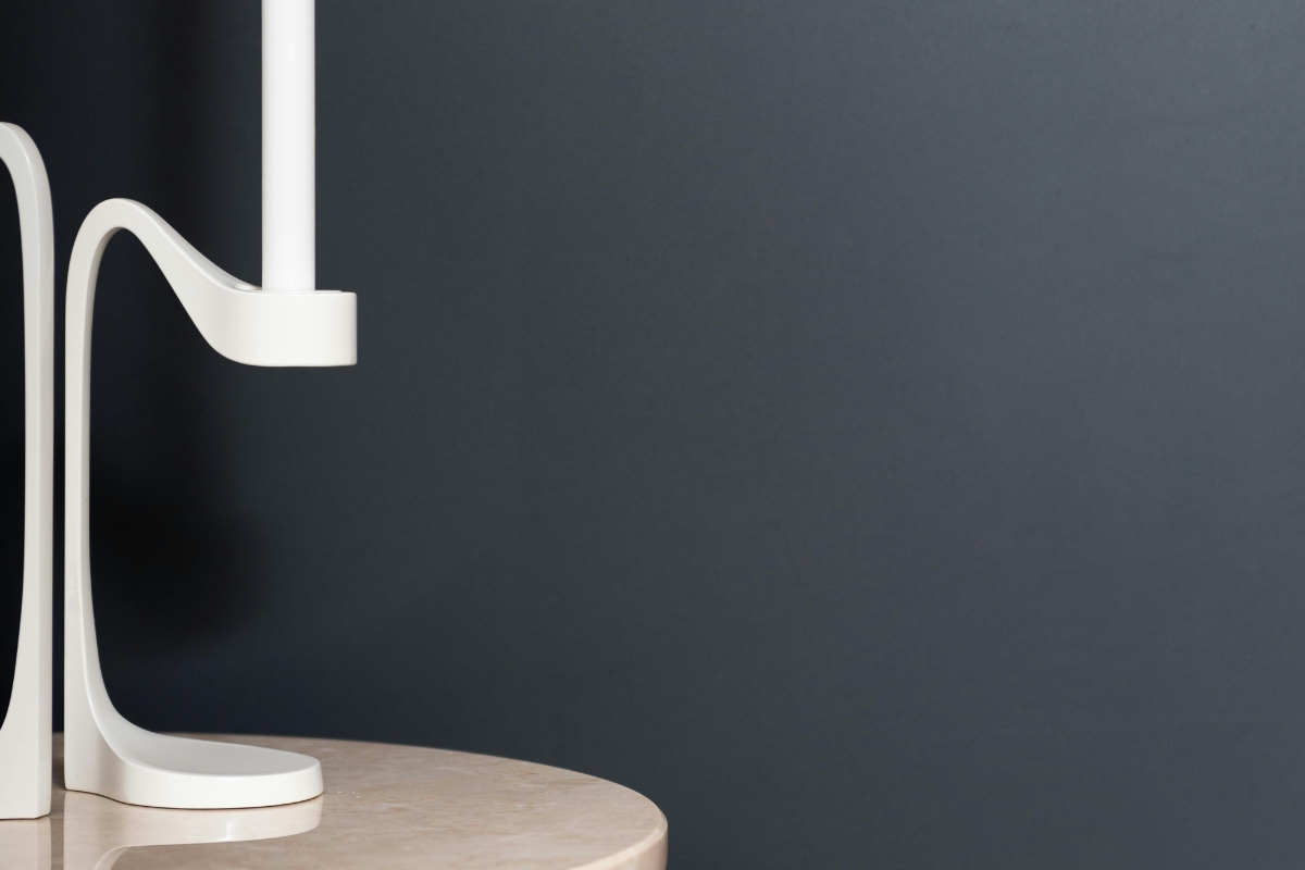 Curved statement sofa as focal point in modern living roomRound accent chair used as statement piece in cozy interior