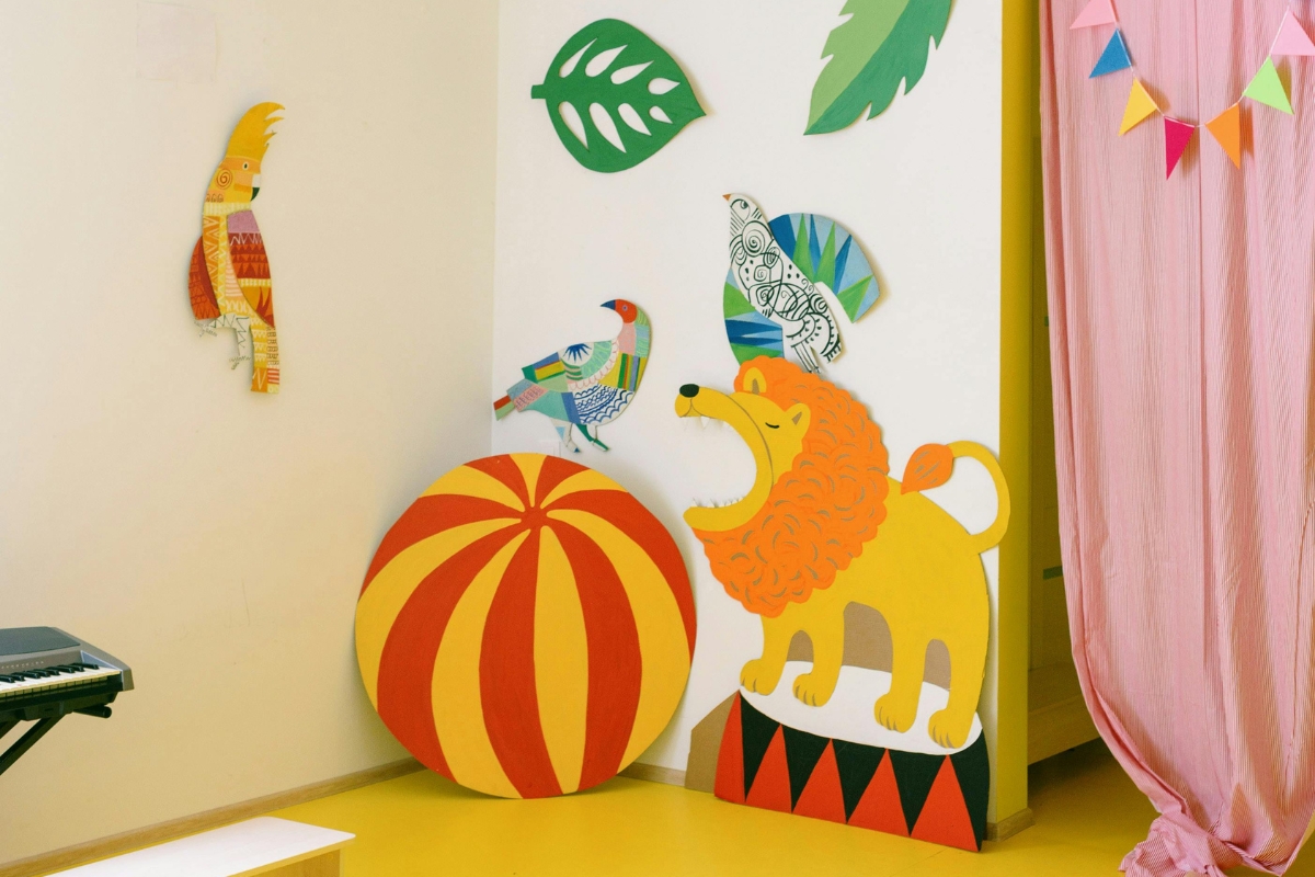 Imagination-driven kids room designed around a storytelling concept with creative decor, cozy reading corner, soft lighting, and interactive play elements
