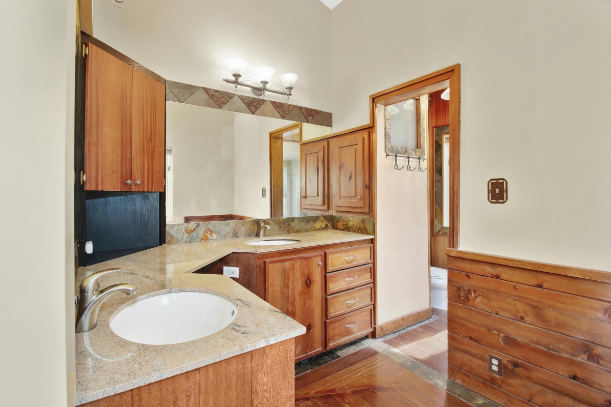 Warm earth-toned bathroom with beige walls and natural wood accents