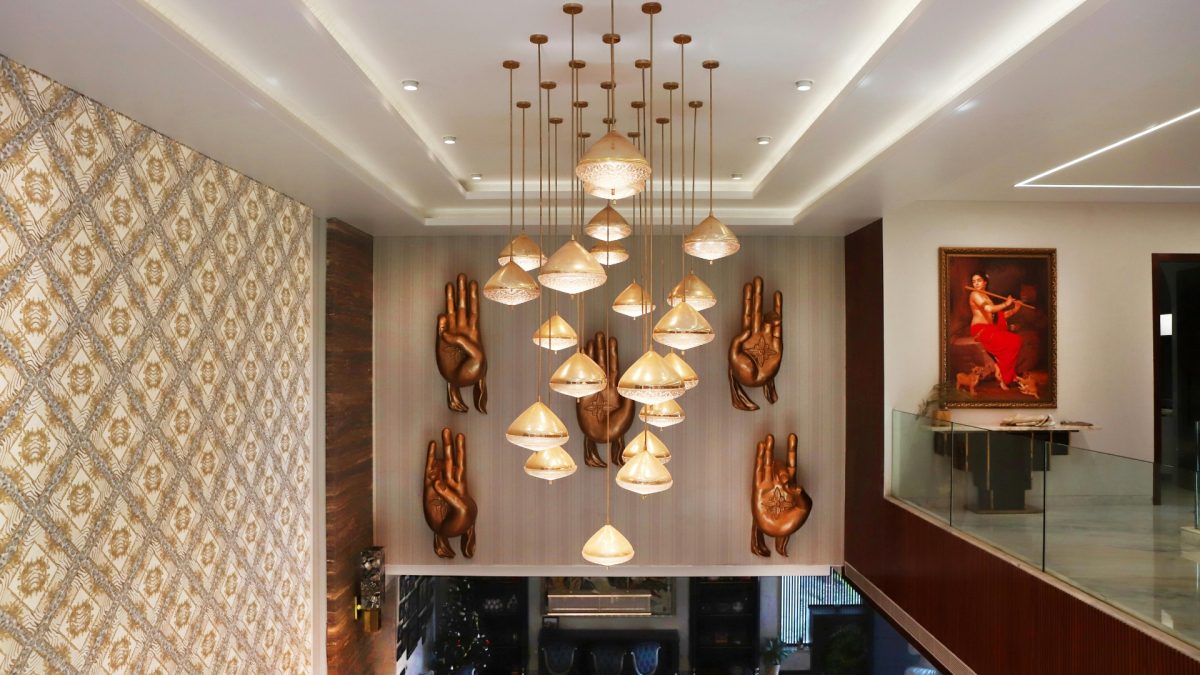 Bold statement ceiling with deep color and modern pendant lighting in living room