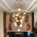 Bold statement ceiling with deep color and modern pendant lighting in living room