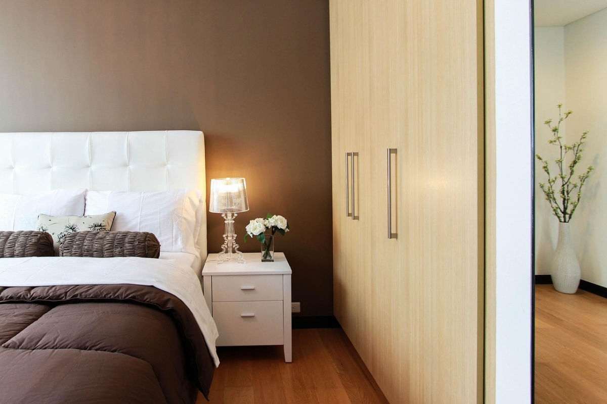 Acrylic bedside table in a modern, light-filled bedroom