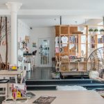 Transparent acrylic coffee table in a modern living room with natural light