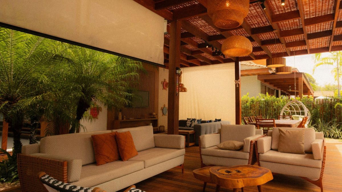 Tropical modern living room with rattan furniture and lush greenery