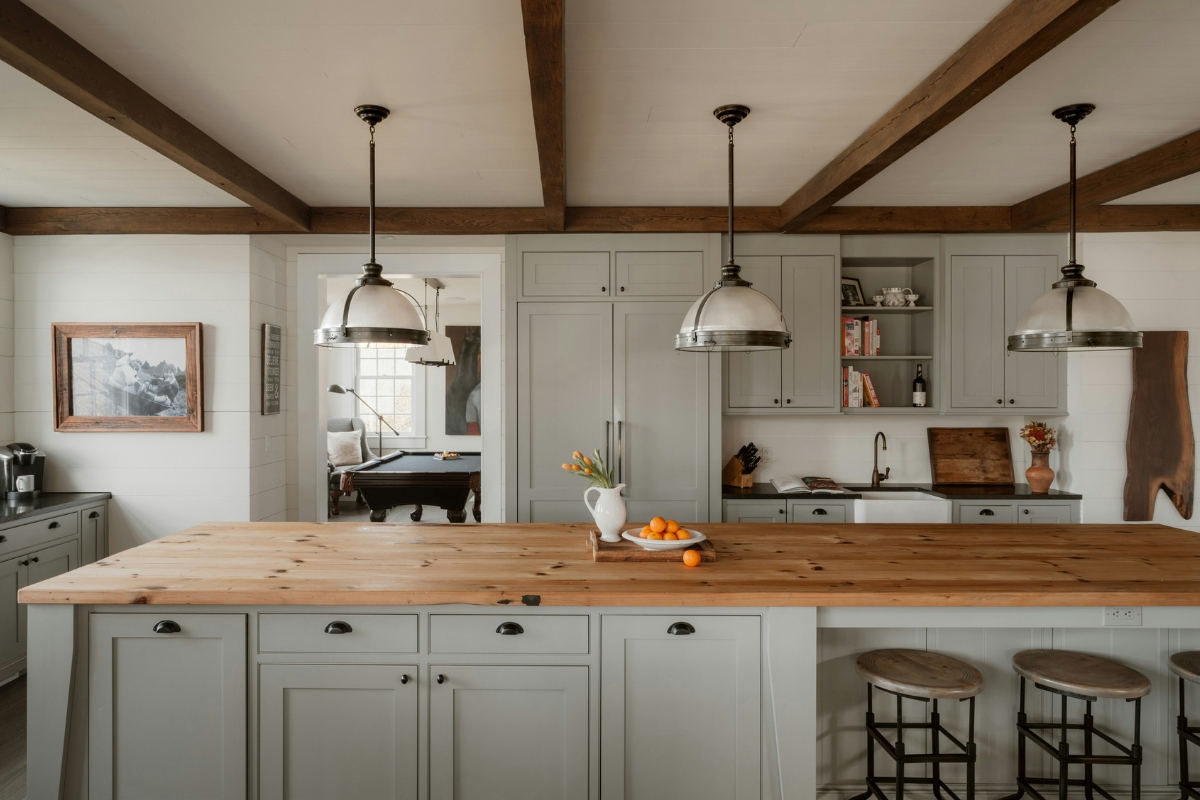 Under-cabinet lighting highlighting textured kitchen wall tiles to enhance depth and create a warm premium kitchen ambiance