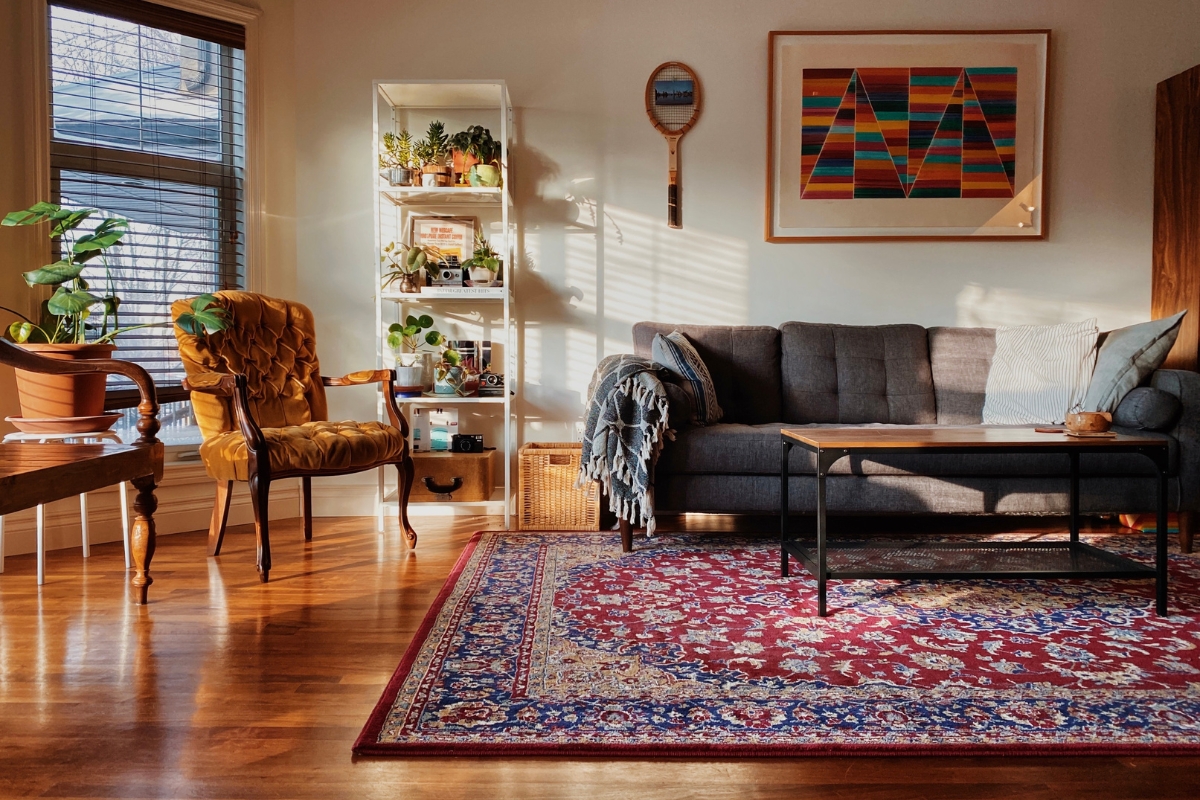 Living room rug styling that anchors furniture and adds layered dimension