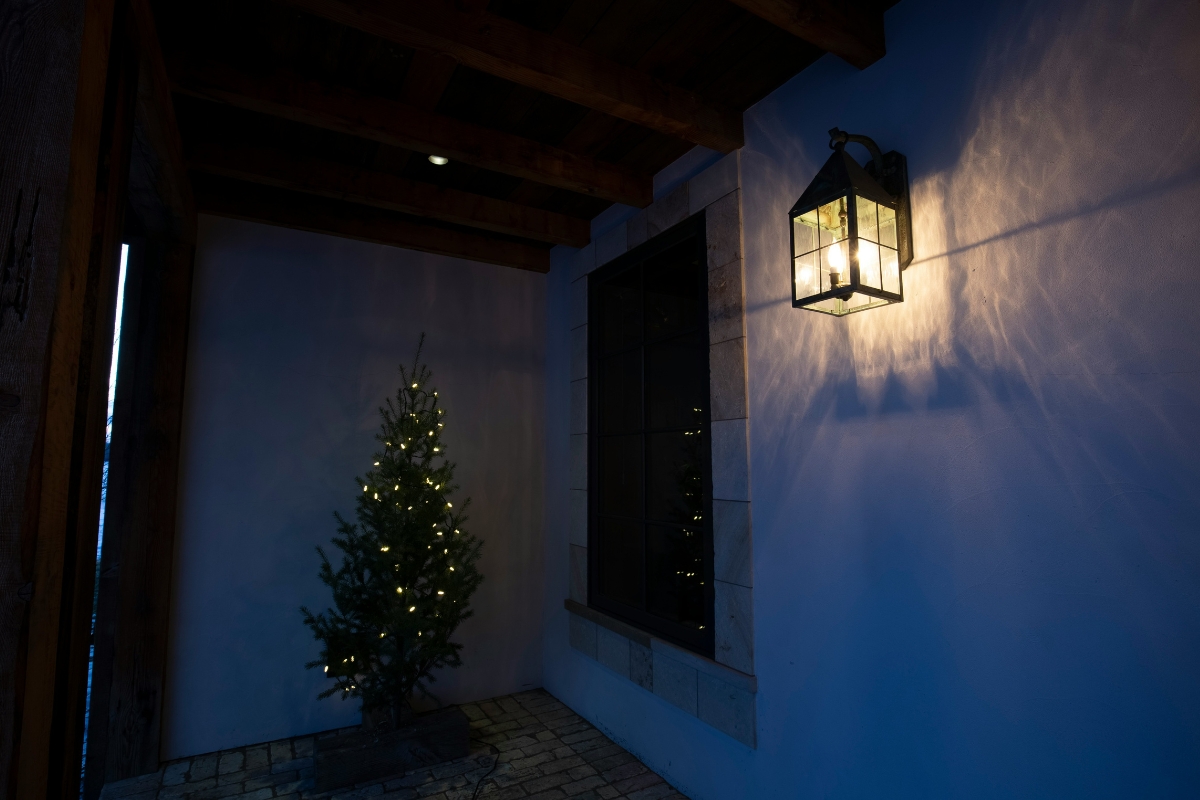 Cozy winter living room with warm lamp light, glowing candles, and soft ambient lighting creating a relaxing and inviting atmosphere after holiday decor is removed.