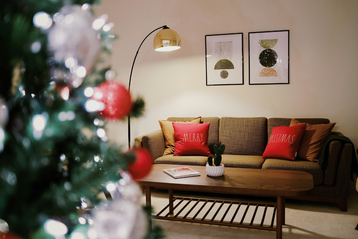 Living room with warm lighting from lamps and candles creating a cozy and inviting winter atmosphere after holiday decorations are removed.