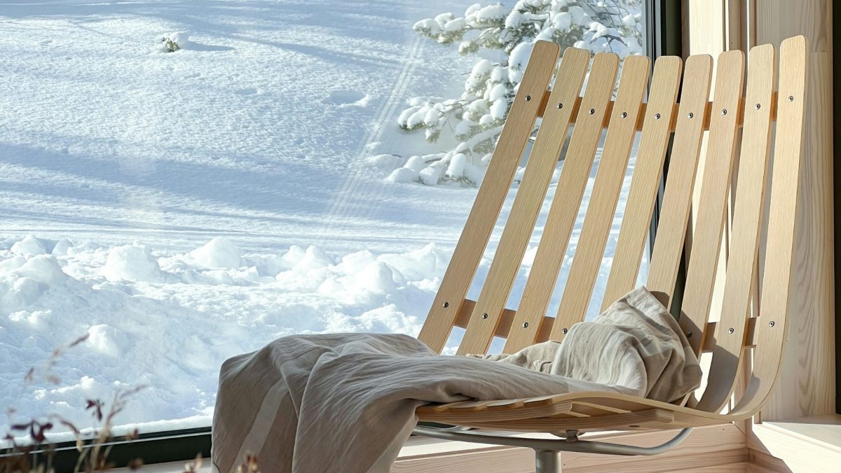 Cozy winter living room with warm layered blankets and soft ambient lighting