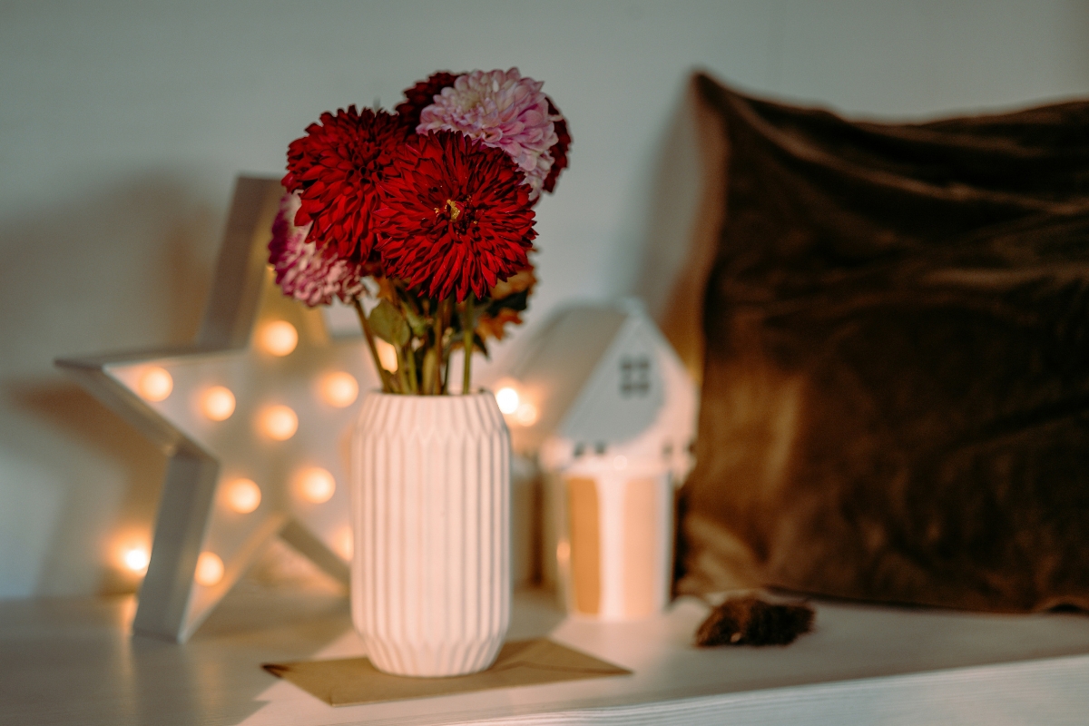 cozy fall home shelf decorated with pumpkins and candles