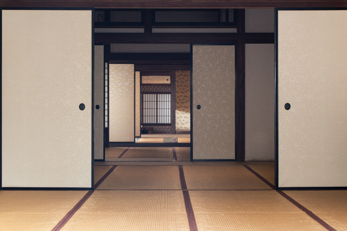 Industrial Japandi interior design with exposed brick and wooden furniture