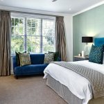 Low profile bed frame in a modern minimalist bedroom