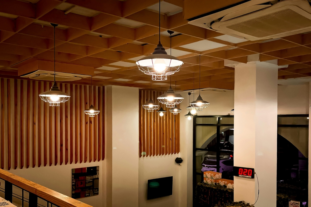 Minimalist ceiling with natural sound panels in a modern living room