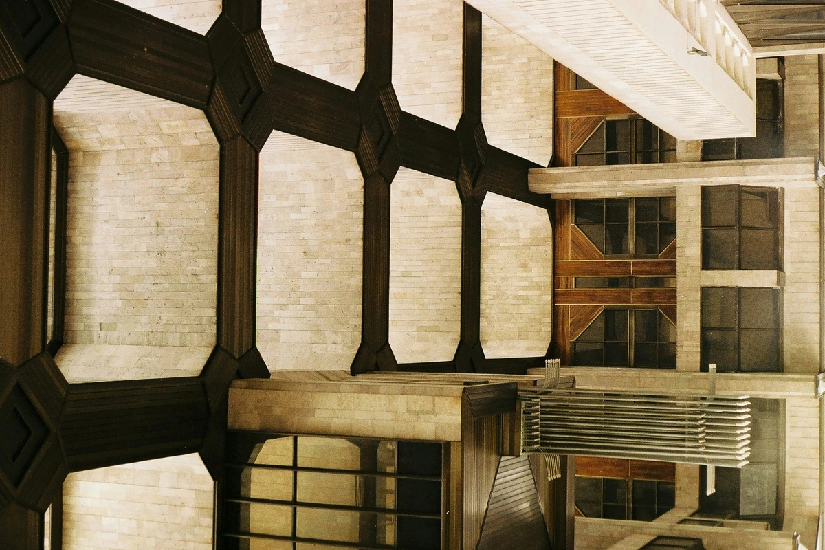 Post apocalyptic brutalist interior design space with raw concrete, distressed textures, minimalist furniture, and dopamine decor accents for warmth