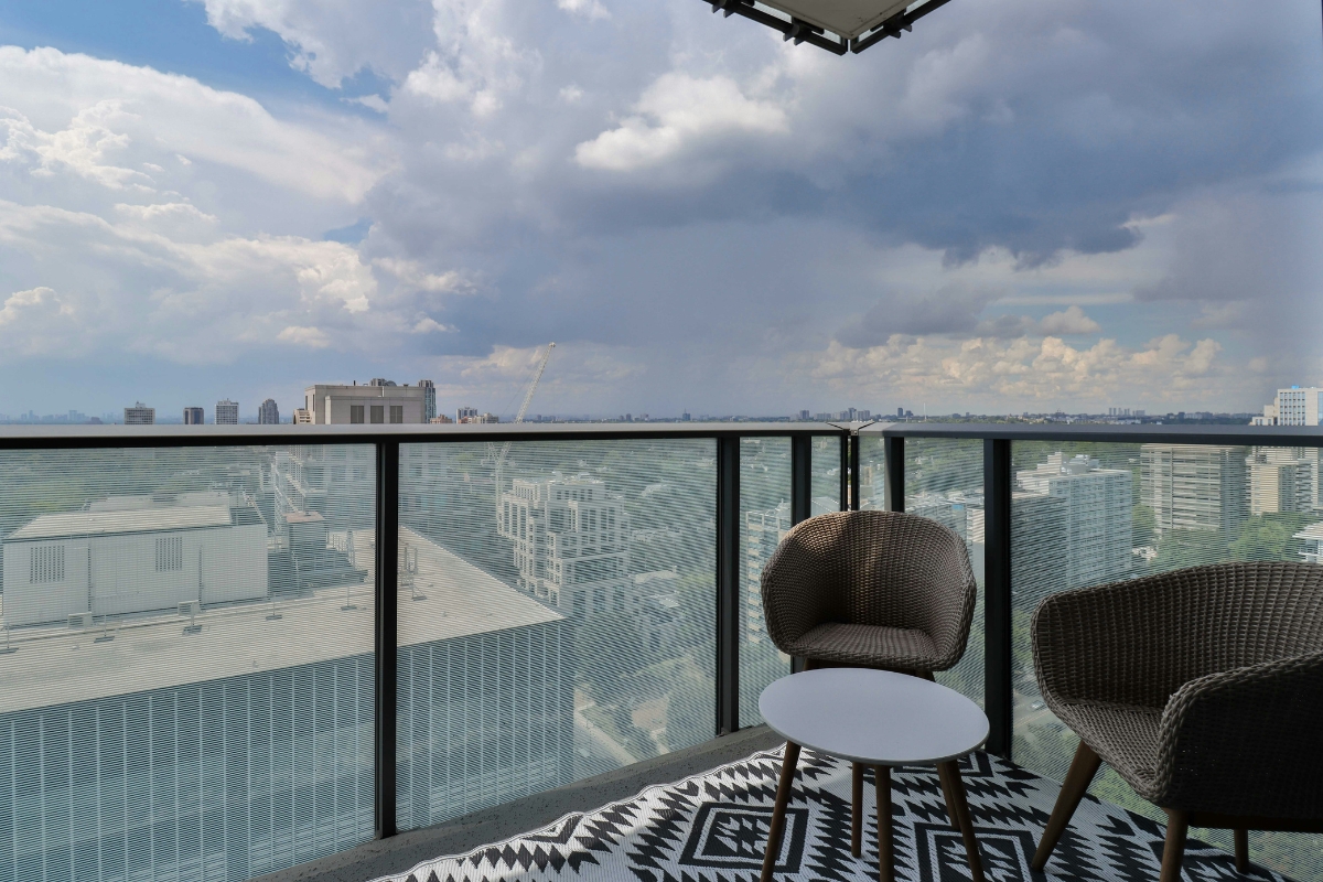 summer-themed cushions on balcony seating for decor