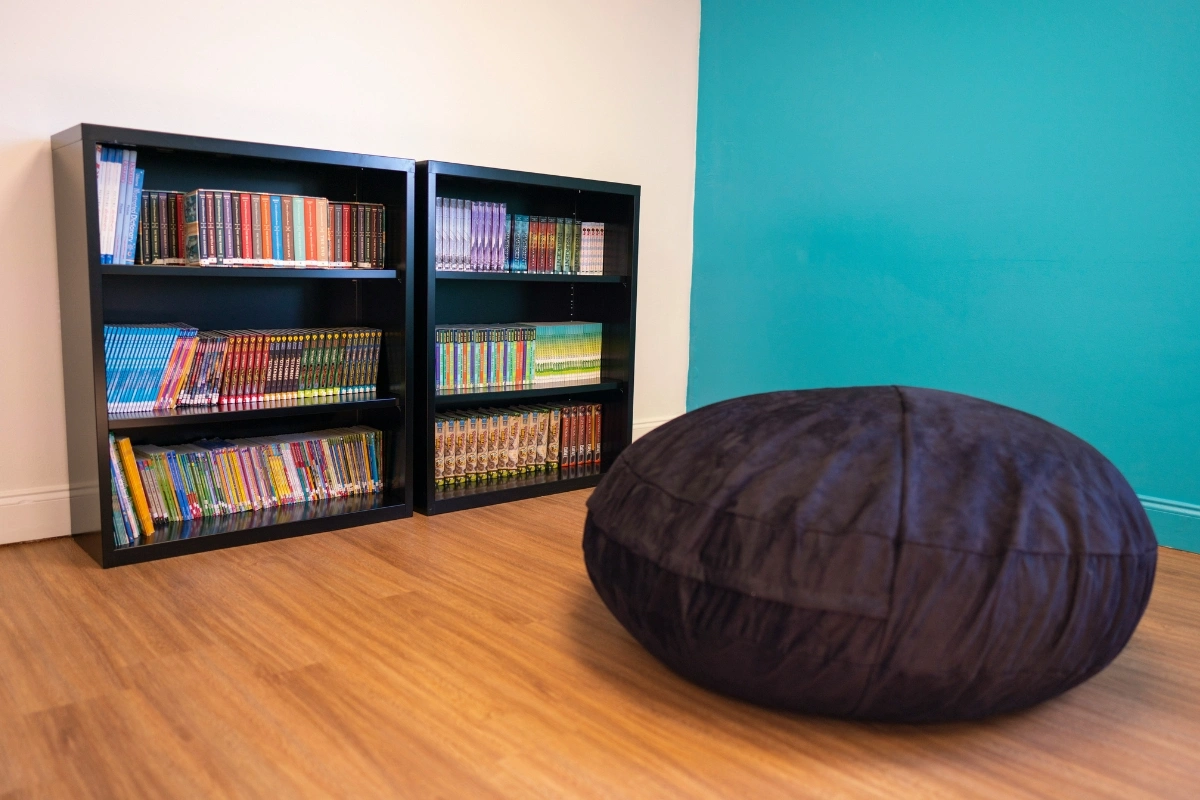 Sensory interior design for neurodiverse individuals with calming multi-sensory elements like soft lighting, textures, and comfortable seating