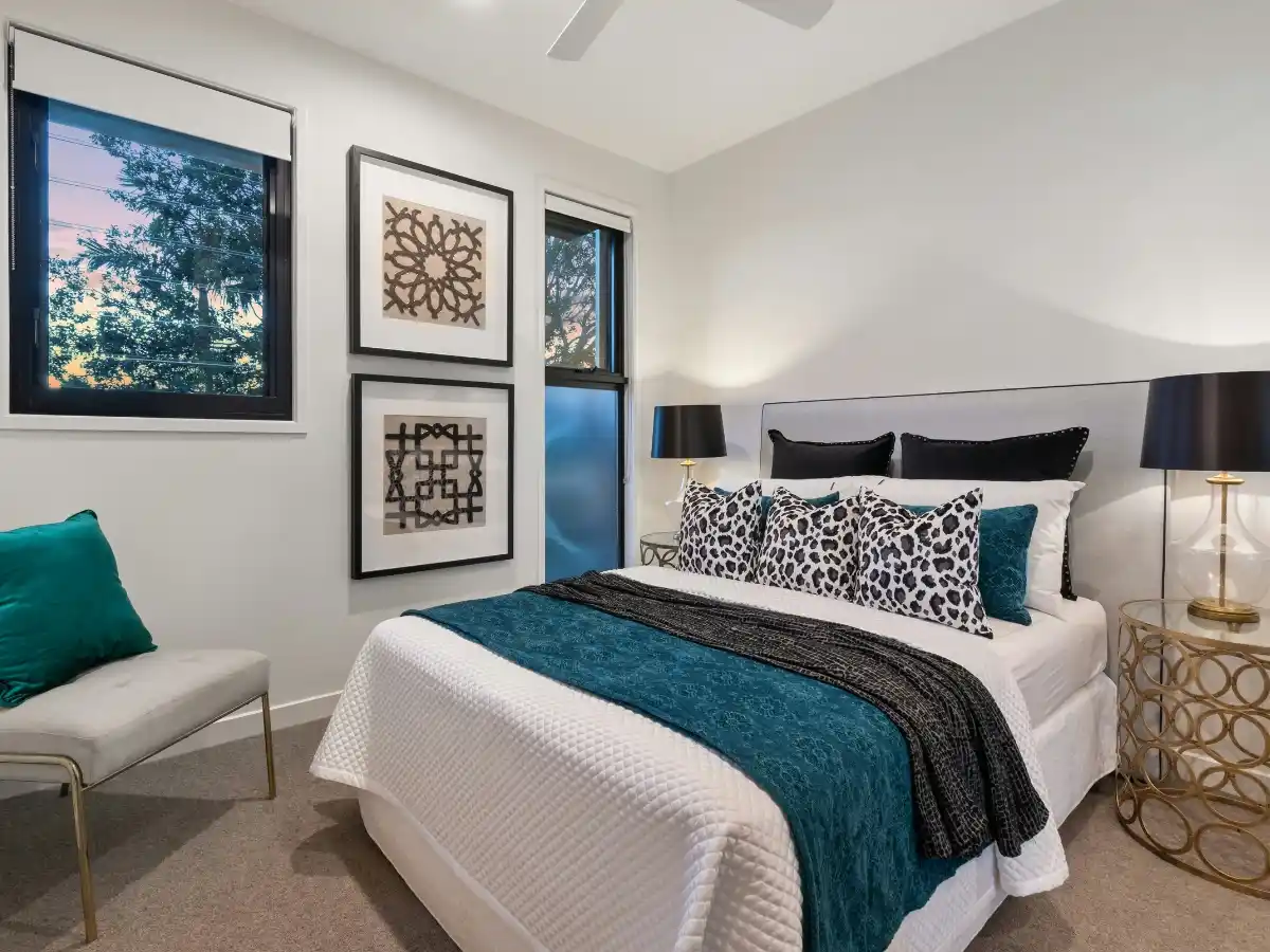 Elegant guest bedroom featuring warm Bedroom Color Ideas with cozy bedding, soft lighting, and stylish interior decor.