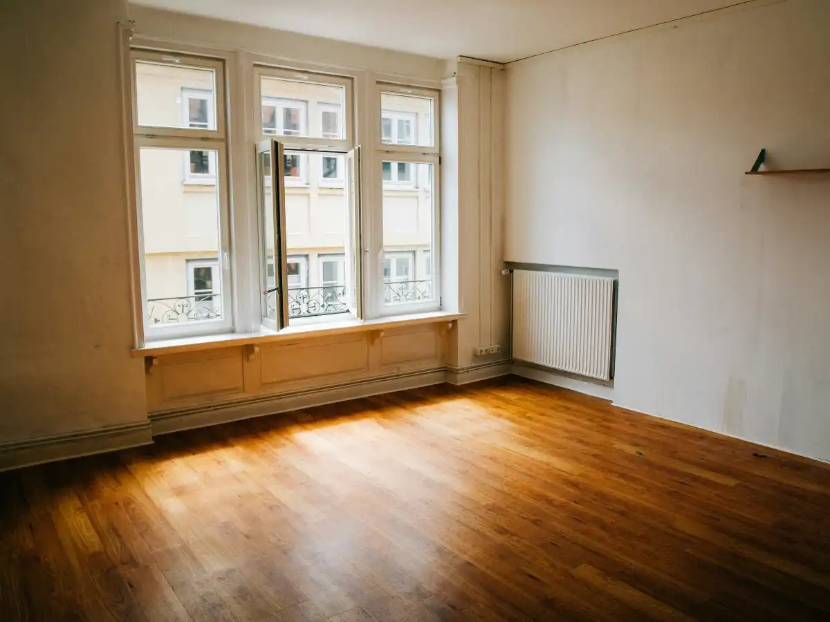 studio apartment layout showing space zoning techniques 
