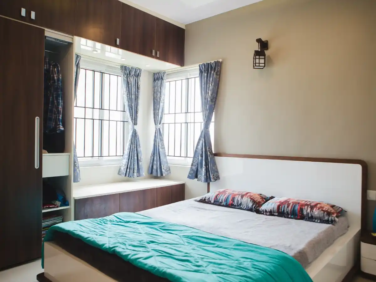 Modern mens bedroom featuring bold Bedroom Color Ideas with dark tones, cozy lighting, and stylish contemporary decor.