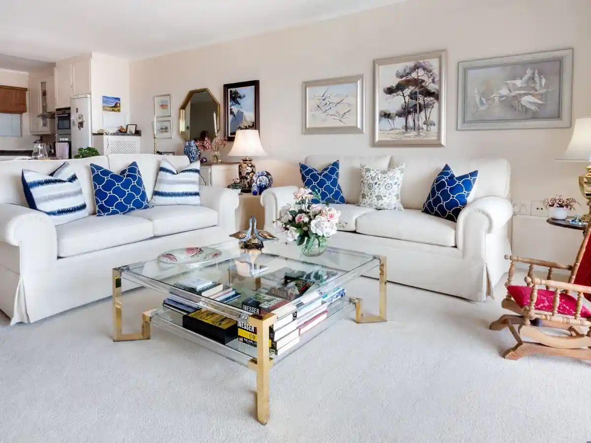 Neutral apartment sofa setup with affordable decor accents