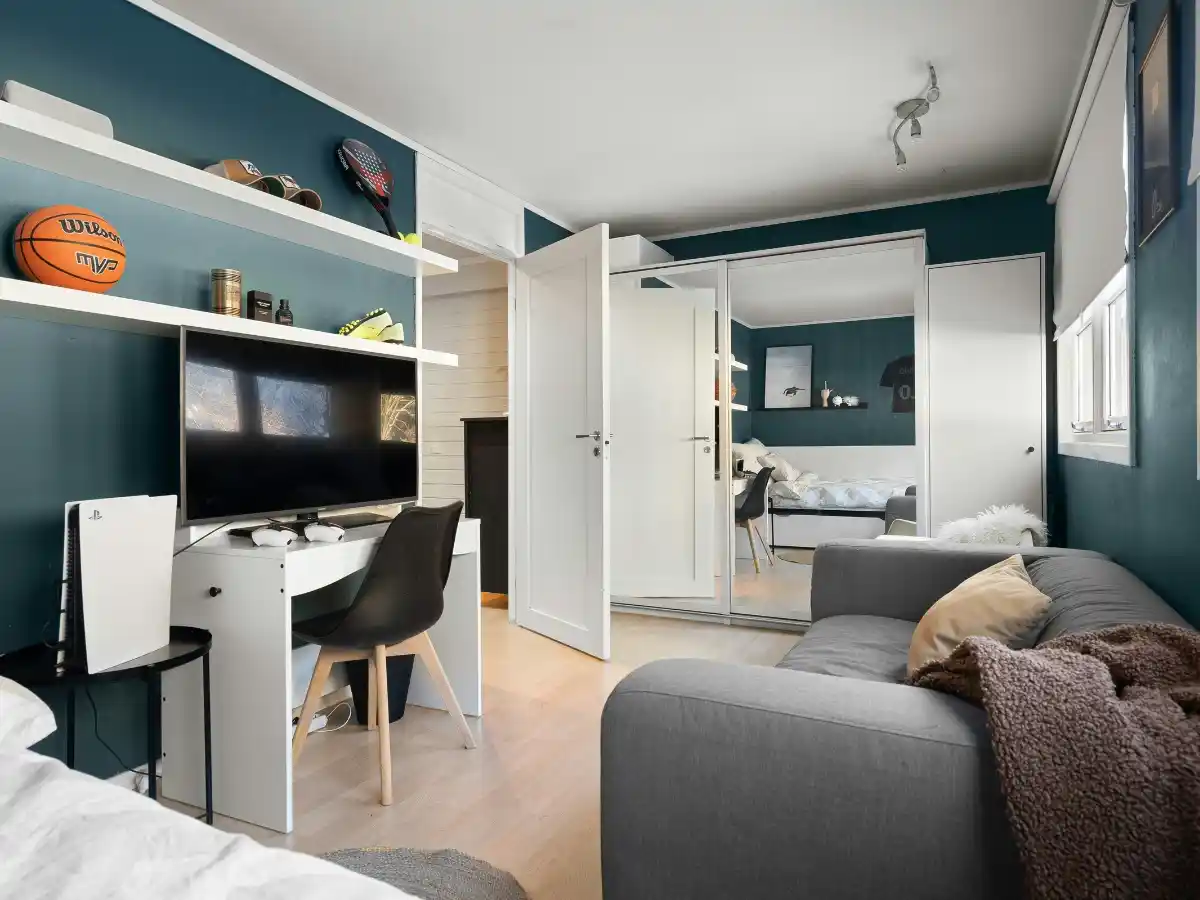 Neutral rug placement in a compact apartment living area 
