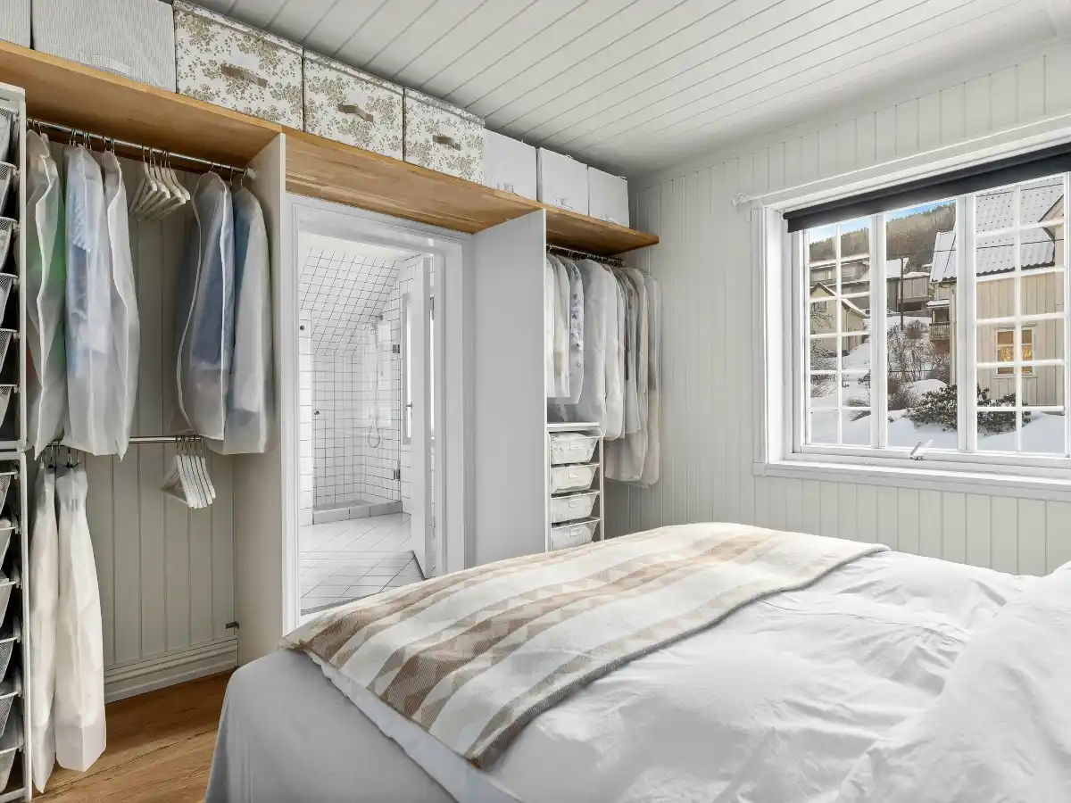 Stylish tiny bedroom with under-bed storage organization 