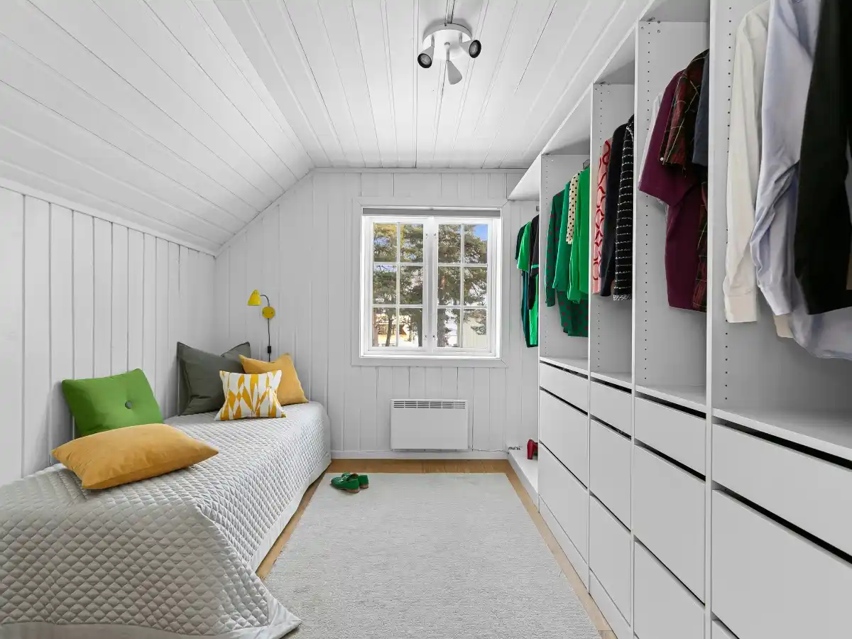 Compact apartment bedroom with multifunctional storage bed 