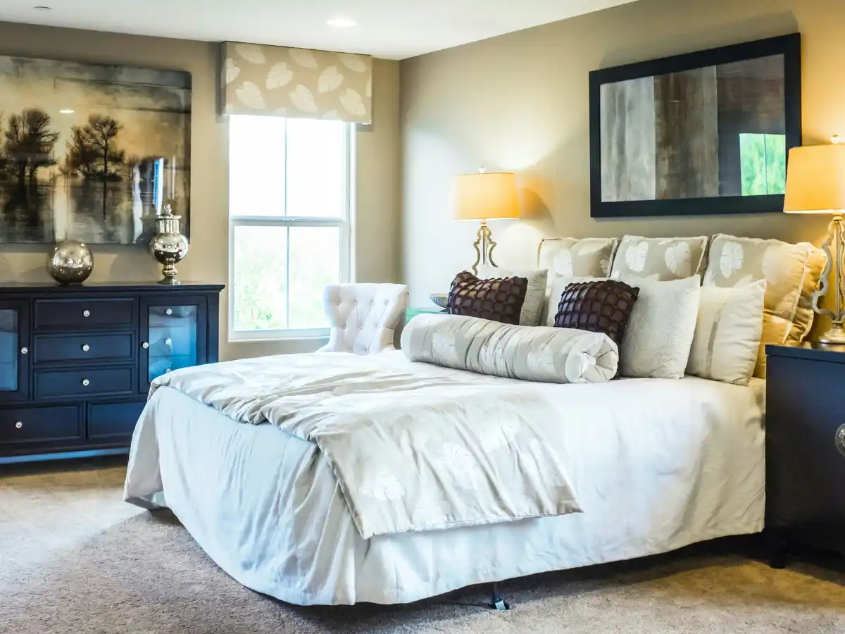 Cozy small bedroom with layered lighting and neutral decor 