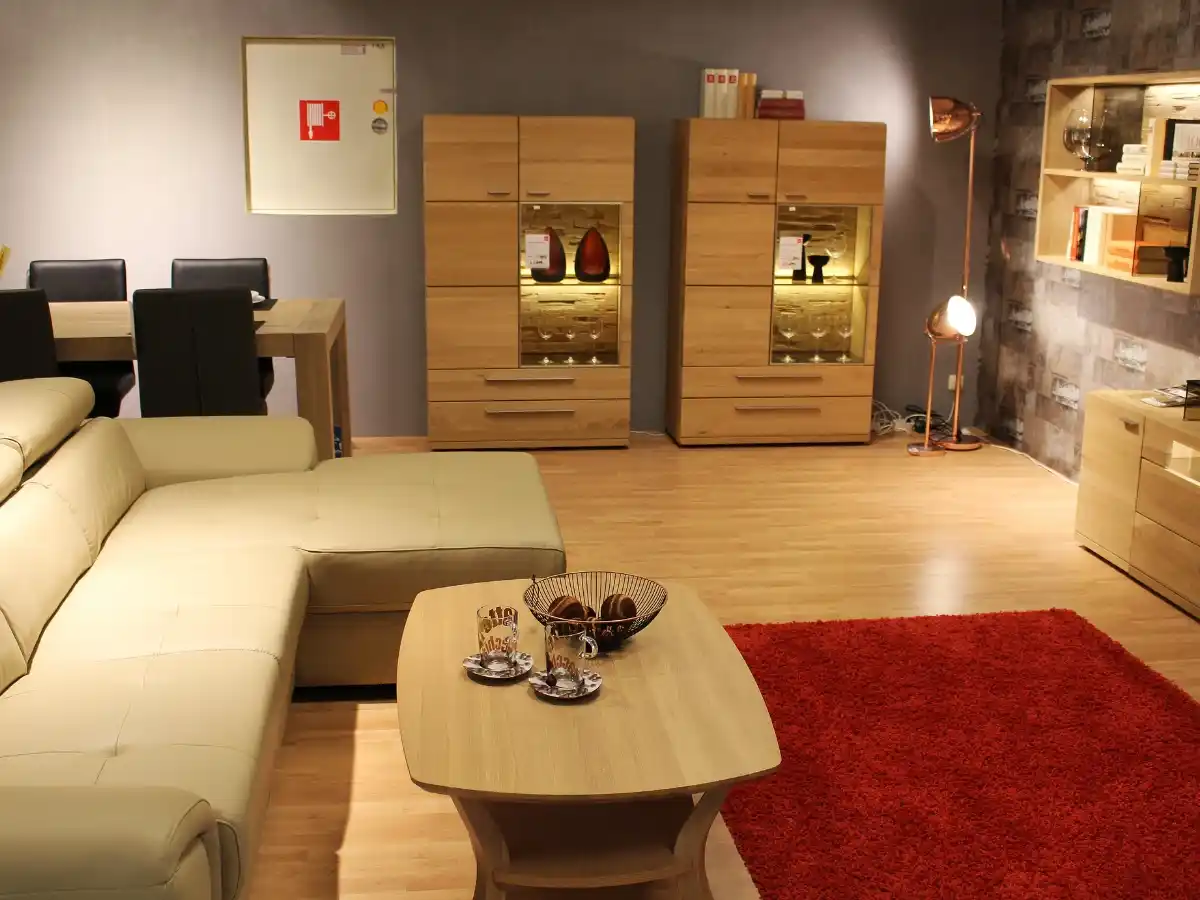 Sofa placed on small rug causing uncomfortable living room feel