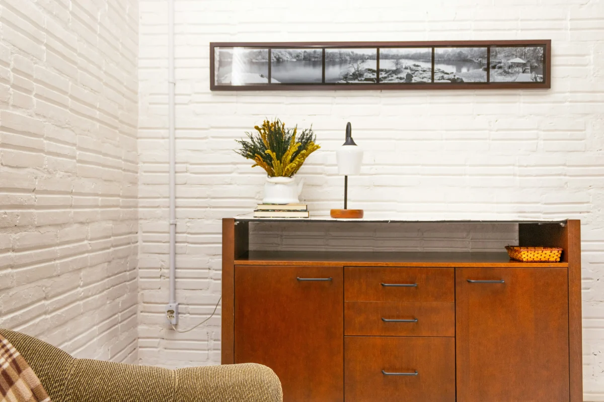 small apartment living room showing designer furniture arrangement tricks