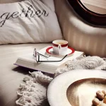 Cozy reading nook ideas for a small space with comfortable seating, warm lighting, soft textures, books, and relaxing decor