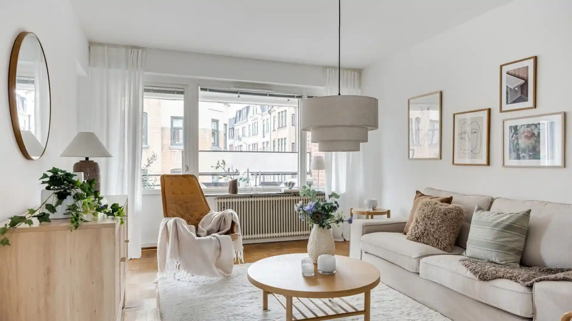 Scandinavian home decor ideas for a cozy modern living room with natural wood, soft colors, cozy textures, and simple furniture