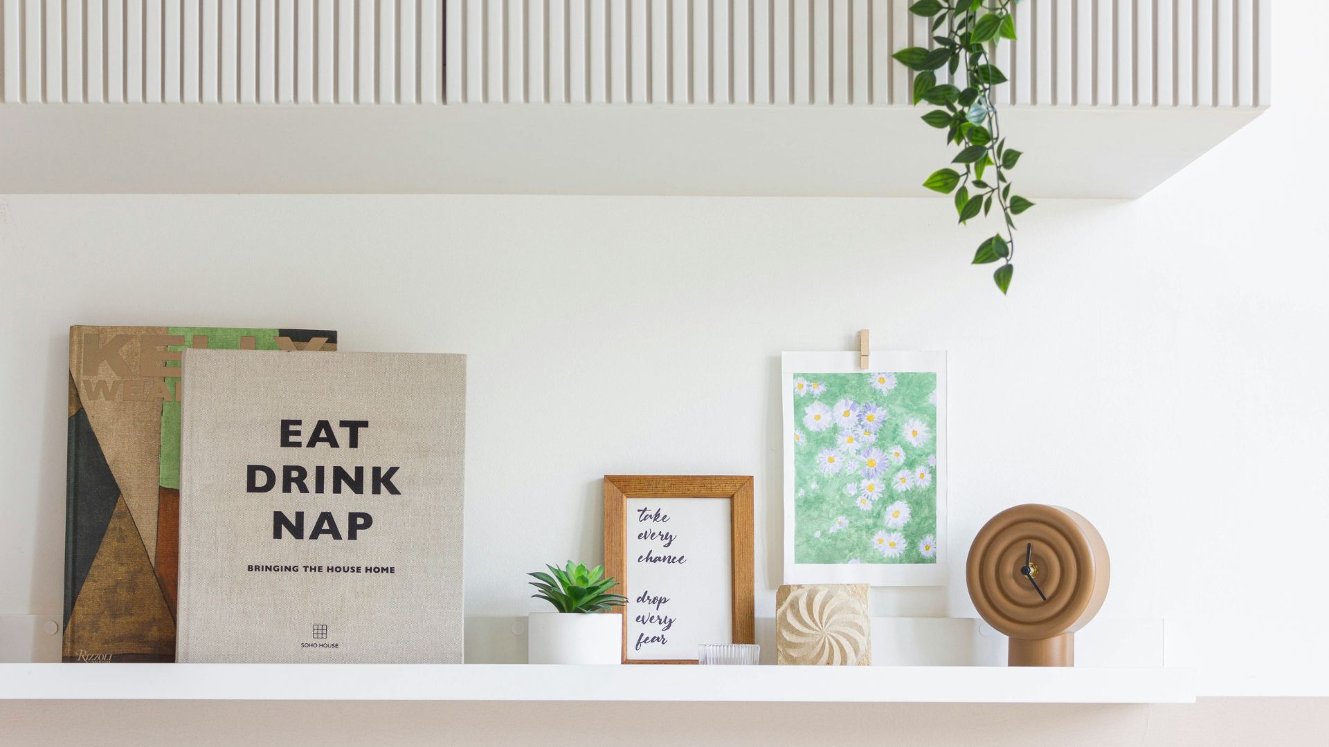 Open Shelf Styling Ideas with books, green plants, baskets, and decorative accents arranged on open shelves